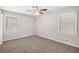 Cozy bedroom with neutral carpet, two windows, and ample natural light at 637 Carlouetta Sw Rd, Mableton, GA 30126
