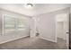 Neutral bedroom with carpet, a closet and access to an attached bathroom at 637 Carlouetta Sw Rd, Mableton, GA 30126