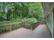 Spacious wood deck overlooking a lush, tree-filled backyard offering privacy and natural beauty at 637 Carlouetta Sw Rd, Mableton, GA 30126
