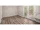 Dining area featuring hardwood floors, neutral walls, and access to an outdoor deck at 637 Carlouetta Sw Rd, Mableton, GA 30126
