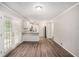 Bright dining area boasts wood floors and natural light from the french doors at 637 Carlouetta Sw Rd, Mableton, GA 30126