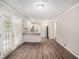Bright kitchen features white cabinets, granite countertops, stainless steel appliances, and hardwood flooring at 637 Carlouetta Sw Rd, Mableton, GA 30126
