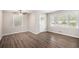 Inviting living room with hardwood floors and large windows offering ample natural light at 637 Carlouetta Sw Rd, Mableton, GA 30126