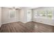 Bright living room with hardwood floors, large windows, and a ceiling fan at 637 Carlouetta Sw Rd, Mableton, GA 30126