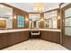 Bathroom featuring marble countertops, a vanity area, and dark wood cabinets at 1016 Old Powers Ferry Rd, Atlanta, GA 30327