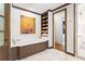A luxurious bathroom with a soaking tub, marble floors, a separate shower, and a closet at 1016 Old Powers Ferry Rd, Atlanta, GA 30327