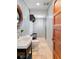 Charming powder room with stylish vanity, round mirror, and wood paneling for a cozy feel at 1016 Old Powers Ferry Rd, Atlanta, GA 30327