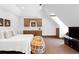 Cozy bedroom with a built-in kitchenette, dormer windows, and a comfortable lounging area at 1016 Old Powers Ferry Rd, Atlanta, GA 30327