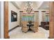 Elegant dining room features a rustic chandelier, neutral decor and a large picture window for lots of natural light at 1016 Old Powers Ferry Rd, Atlanta, GA 30327