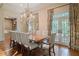 Dining room featuring hardwood floors, natural light, and a chandelier at 1016 Old Powers Ferry Rd, Atlanta, GA 30327
