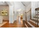 View of the foyer and stairs, complemented by hardwood floors and decorative painting at 1016 Old Powers Ferry Rd, Atlanta, GA 30327