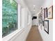 Bright hallway with natural light, picture frame molding and a gallery wall at 1016 Old Powers Ferry Rd, Atlanta, GA 30327