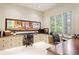 Bright home office with built-in desks, drawers, and large windows offering peaceful views at 1016 Old Powers Ferry Rd, Atlanta, GA 30327