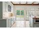 Modern kitchen with stainless steel appliances, granite countertops, and french doors to a deck at 1016 Old Powers Ferry Rd, Atlanta, GA 30327