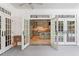 An open kitchen seen from the back porch, featuring white cabinetry and a central island at 1016 Old Powers Ferry Rd, Atlanta, GA 30327