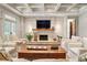Cozy living room boasting a stone fireplace, wood accents, and built-in shelving at 1016 Old Powers Ferry Rd, Atlanta, GA 30327