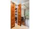 A well-organized pantry with custom wood doors next to the dining area at 1016 Old Powers Ferry Rd, Atlanta, GA 30327