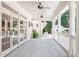 Inviting back porch featuring ceiling fans and views of the backyard at 1016 Old Powers Ferry Rd, Atlanta, GA 30327
