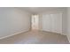 Neutral bedroom with carpeted floors, a closet, and a doorway to another room at 3807 Lance Bluff Ct, Duluth, GA 30097