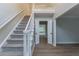 Staircase with carpeted steps and white railing leading to the second floor at 3807 Lance Bluff Ct, Duluth, GA 30097