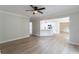Open-concept living room with an adjacent kitchen and new hardwood floors at 3807 Lance Bluff Ct, Duluth, GA 30097