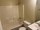 Standard bathroom features a shower-tub combination, single sink vanity and neutral finishes at 796 Cohran Store Rd, Douglasville, GA 30134
