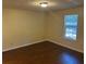 Inviting bedroom with wood floors and a window providing ample natural light at 796 Cohran Store Rd, Douglasville, GA 30134