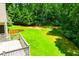 Backyard view from the deck showing a well-maintained lawn and surrounding trees at 8040 Banks Mill Rd, Douglasville, GA 30135