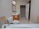 Well-lit bathroom featuring a tile floor, vanity, and an open shower area at 8040 Banks Mill Rd, Douglasville, GA 30135