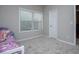 Bedroom featuring a window, carpeted floor and closet at 8040 Banks Mill Rd, Douglasville, GA 30135