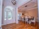 Elegant dining room with hardwood floors and stylish lighting fixture at 8040 Banks Mill Rd, Douglasville, GA 30135