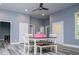 Dining area features light grey walls, hardwood floors, modern lighting, and a table with chairs at 8040 Banks Mill Rd, Douglasville, GA 30135