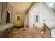 Inviting front porch with stone accents and a welcoming yellow front door at 8040 Banks Mill Rd, Douglasville, GA 30135