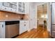 Kitchen with stainless steel appliances, white cabinets, and breakfast area in view at 8040 Banks Mill Rd, Douglasville, GA 30135