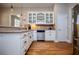 A modern kitchen with updated appliances, white cabinets, and bright, natural light at 8040 Banks Mill Rd, Douglasville, GA 30135