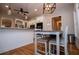 Open kitchen with white cabinetry, stainless steel appliances and a cozy breakfast nook at 8040 Banks Mill Rd, Douglasville, GA 30135