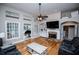 Spacious living room with high ceilings, fireplace, and large windows for natural light at 8040 Banks Mill Rd, Douglasville, GA 30135