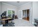 Bright home office with neutral carpet, double doors, and natural light at 8040 Banks Mill Rd, Douglasville, GA 30135