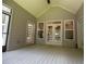 Covered porch with view of other rooms and deck at 8040 Banks Mill Rd, Douglasville, GA 30135
