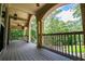 Spacious outdoor porch with a beautiful view of the surrounding greenery at 8040 Banks Mill Rd, Douglasville, GA 30135