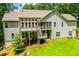 Rear exterior of the home showcasing a multi-level deck and a spacious backyard at 8040 Banks Mill Rd, Douglasville, GA 30135