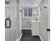 Updated bathroom features a glass enclosed shower, and a modern vanity at 847 Magna Carta Nw Dr, Atlanta, GA 30318