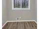 Bright bedroom features wood-look floors, natural light and fresh paint at 847 Magna Carta Nw Dr, Atlanta, GA 30318