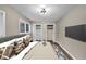 Bedroom with modern lighting, double closets, wall-mounted TV and natural light at 847 Magna Carta Nw Dr, Atlanta, GA 30318