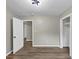 Cozy bedroom featuring an open closet and view to another room at 847 Magna Carta Nw Dr, Atlanta, GA 30318