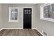 Bright entryway with windows flanking the front door and plank flooring at 847 Magna Carta Nw Dr, Atlanta, GA 30318