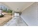 Covered patio with concrete flooring provides an outdoor space for relaxation at 847 Magna Carta Nw Dr, Atlanta, GA 30318