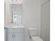 Bathroom featuring a bright white sink, vanity, mirror, and walk-in shower with white subway tiles at 102 Brackley Dr, Cumming, GA 30040