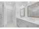 Modern bathroom features double vanity, framed mirrors, and glass shower at 102 Brackley Dr, Cumming, GA 30040