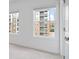 Bedroom with neutral carpet, large windows, and painted walls at 102 Brackley Dr, Cumming, GA 30040